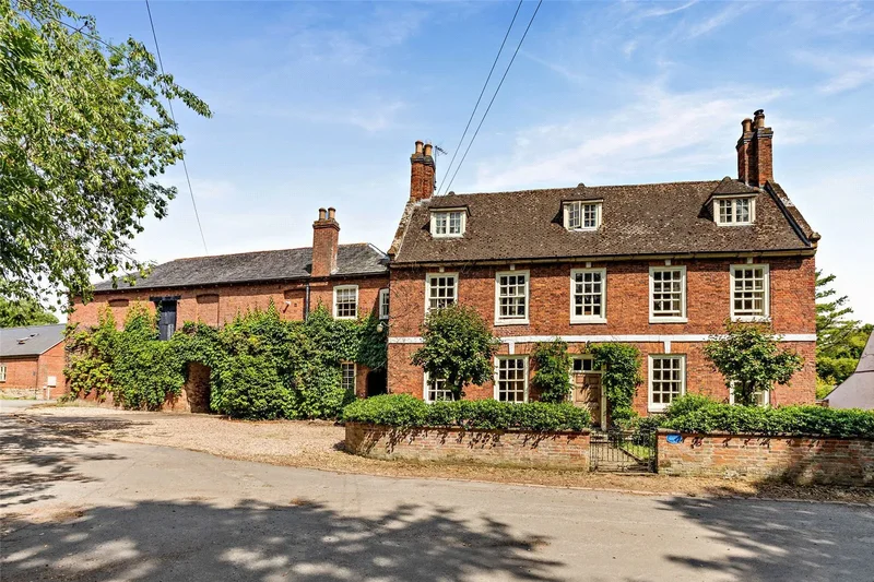 A Queen Anne farmhouse with coachhouse, equestrian facilities and land