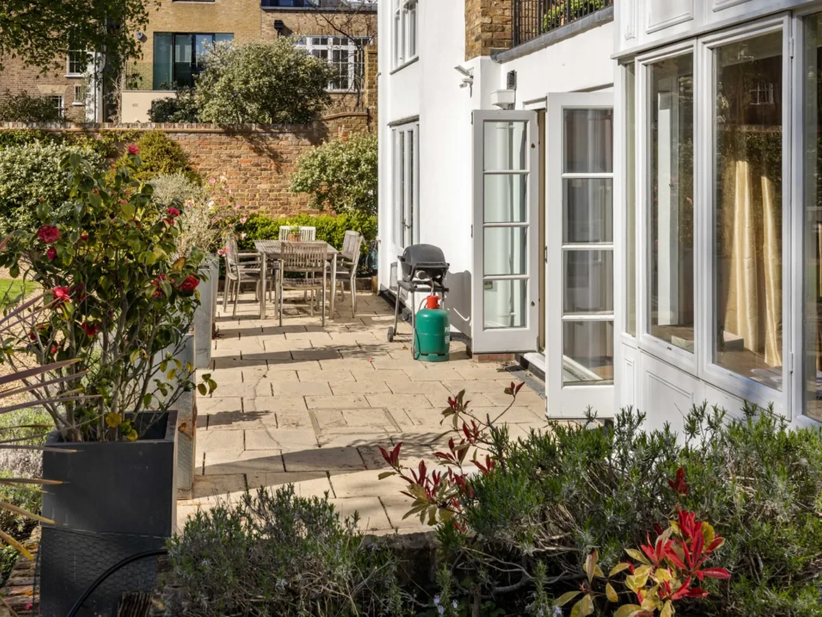 Rarely available two-bedroom, two-bathroom apartment situated on the garden level (with passenger li