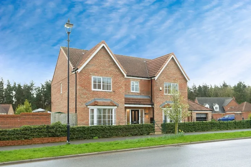 This executive family home blends modern elegance with natural surroundings. Close to excellent tran