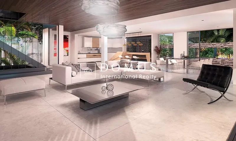 Modern villa with sea view immersed in the hills