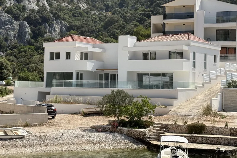 Sevid - newly built luxury villa with pool, first row to the sea