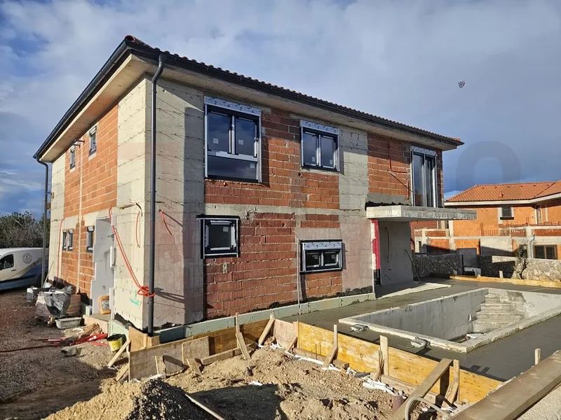 Malinska, new semi-detached house with swimming pool and open sea view.