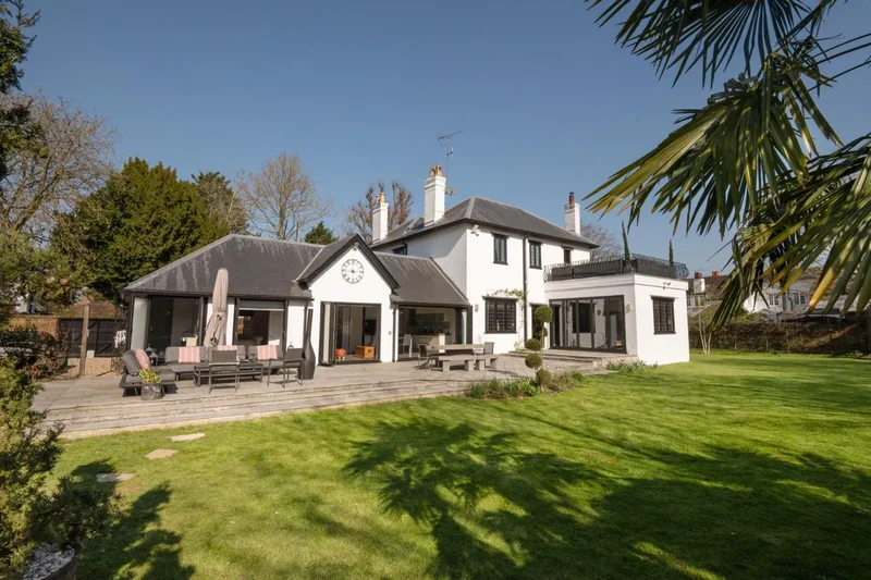 An exceptional family home with designer gardens and two multi-purpose barns