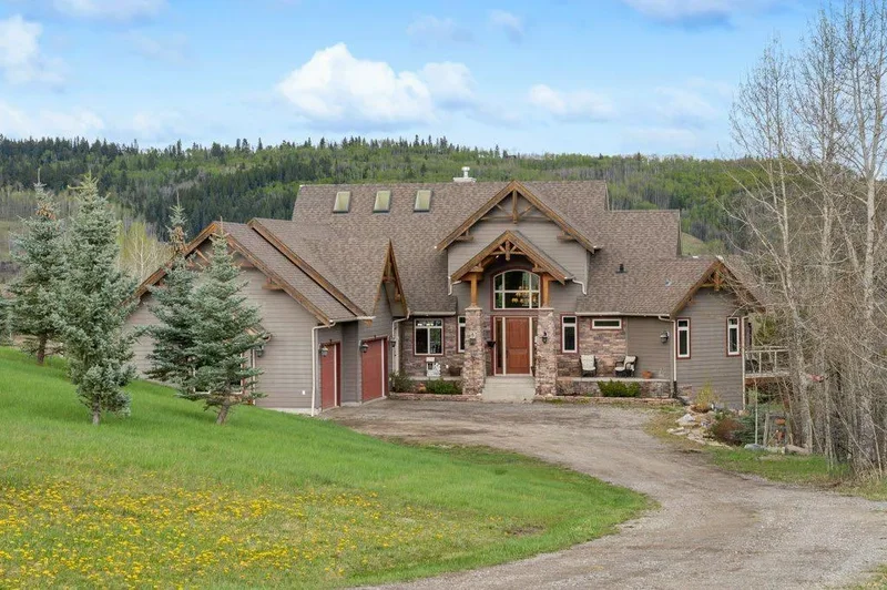 exceptional home in prestigious Priddis Creek Estates