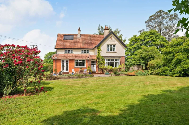 A charming home with detached cottage, nestled in 9.8 acres of pretty grounds, in a rural setting