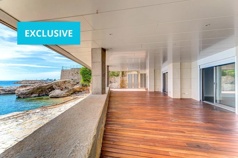 Exclusive seafront property with large terrace and direct private access to the sea.
