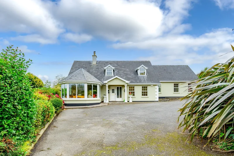 Charming residence on approx.1 acre of mature, landscaped gardens offering superb privacy.